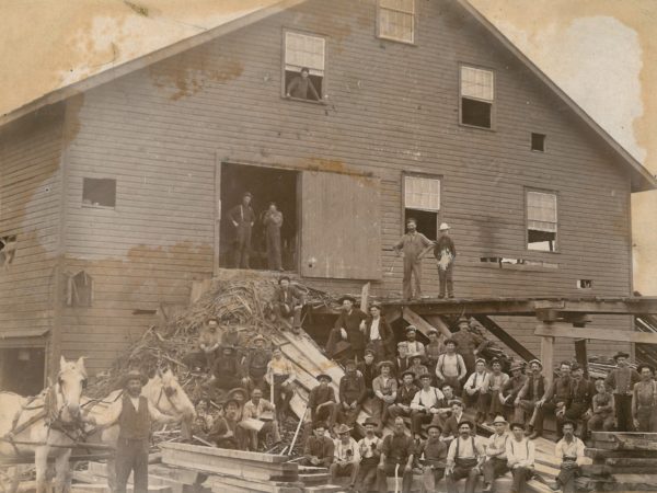 Workers in front of Sullivan’s Lumber Mill in Canto