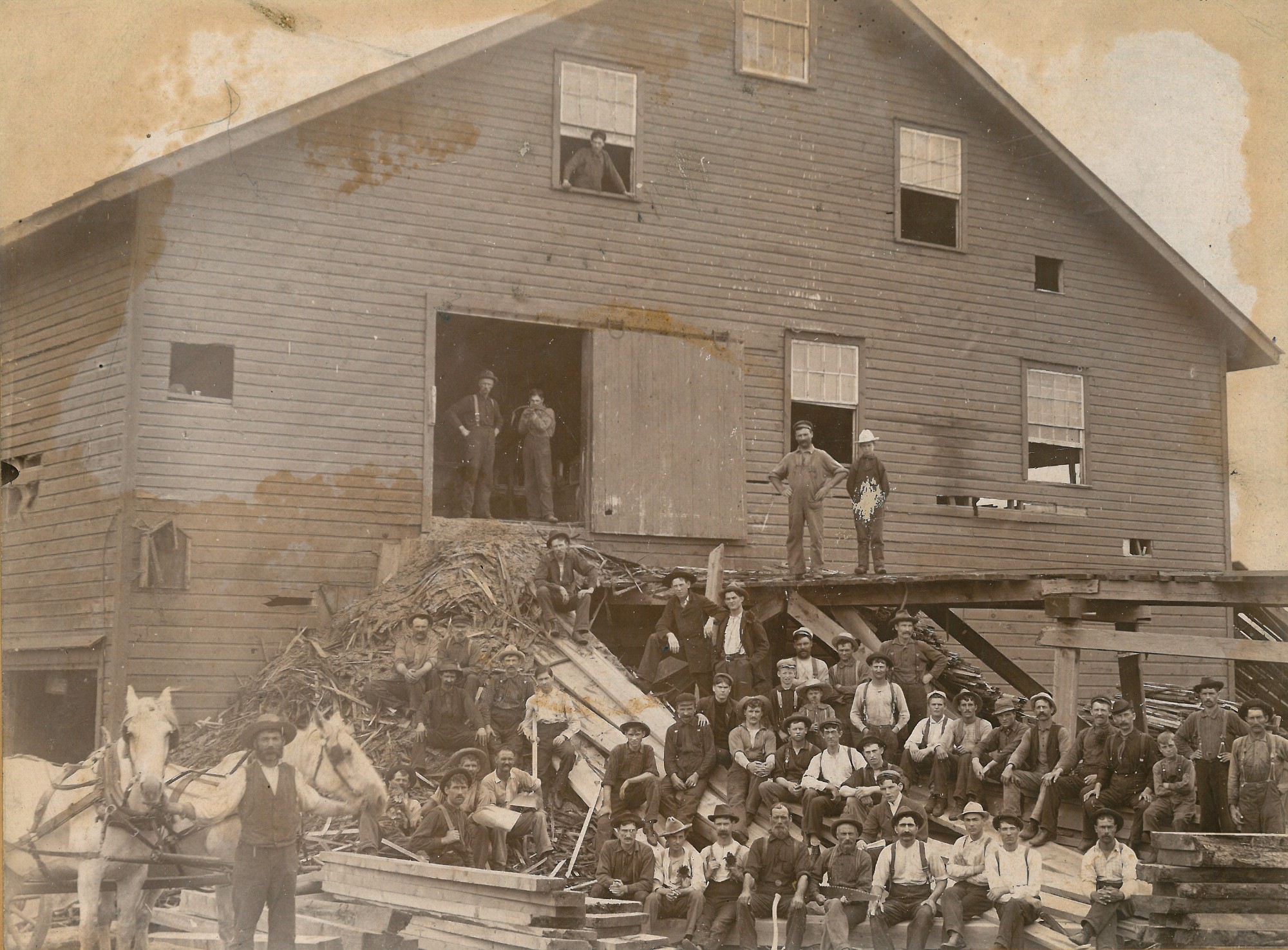 Workers in front of Sullivan’s Lumber Mill in Canton