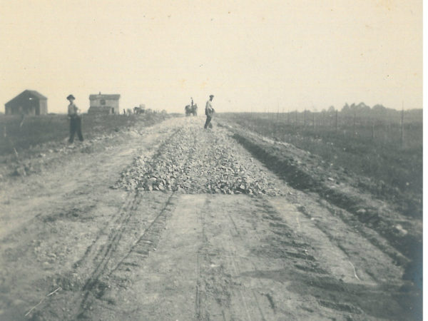 Laying crushed stone for a road in Saint Lawrence