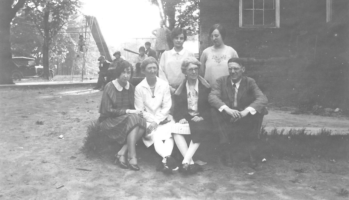 Teachers in front of a school in Waddington