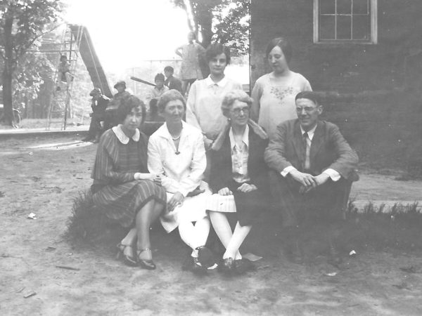 Teachers in front of a school in Waddington