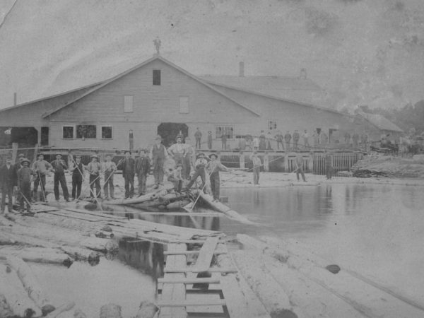 Employees and loggers in front of Sherwin Lumber Mill in Canton