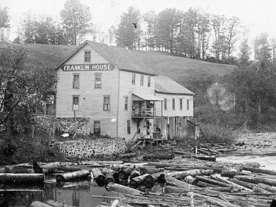 Oswegatchie River filled with pulp logs in Harrisville