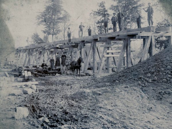 Construction of a trestle bridge in the town of De Kalb