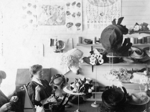 Milliner Clara Grant working on a hat in her store in Hermon