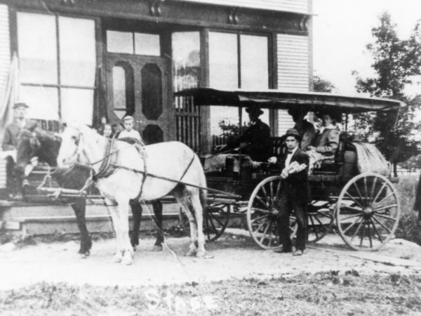 Station wagon in front of Post Office in Lawrence