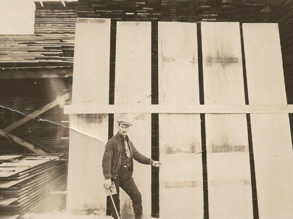 Timber Scaler Jack Hanley with extremely large Birch planks in Cranberry Lake