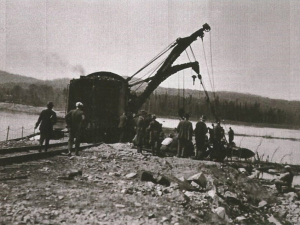 Barnhart loader lifting a locomotive out of Silver Pond in Cranberry Lake