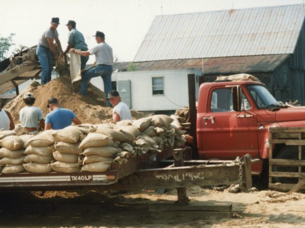 Filling and stacking bags of dirt for construction of the Iroquois Pipeline in Hermon