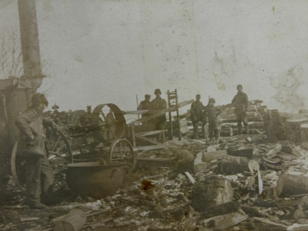 Workers pose with drag saw in Hermon