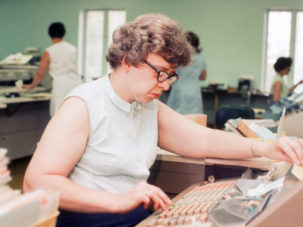 Jane Garvey posting transactions at the Champlain National Bank in Willsboro