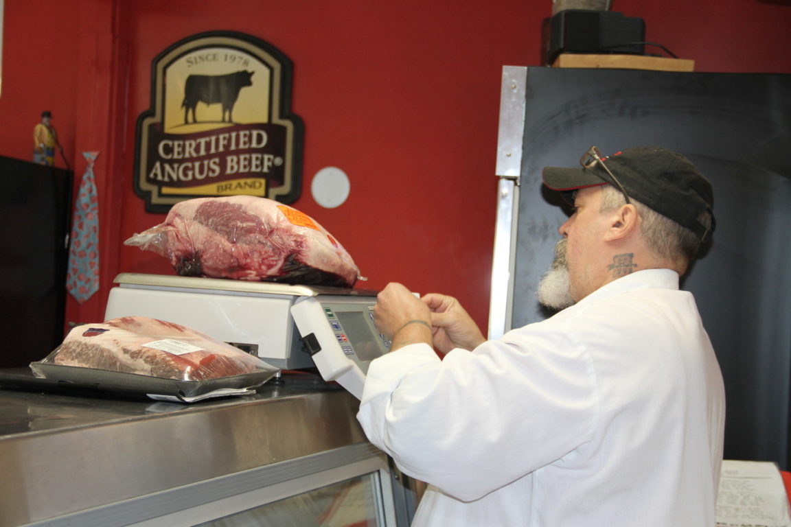 Pricing meat in Walker’s Neighborhood Butcher Shop in Lake Placid
