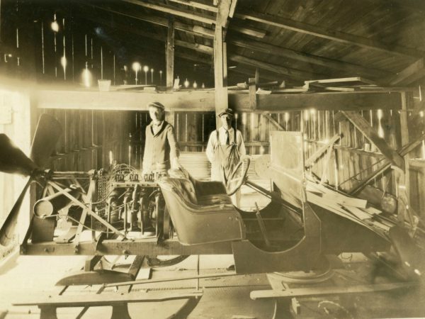 Soper Brothers with their ice sled in the Soper garage in Hammond