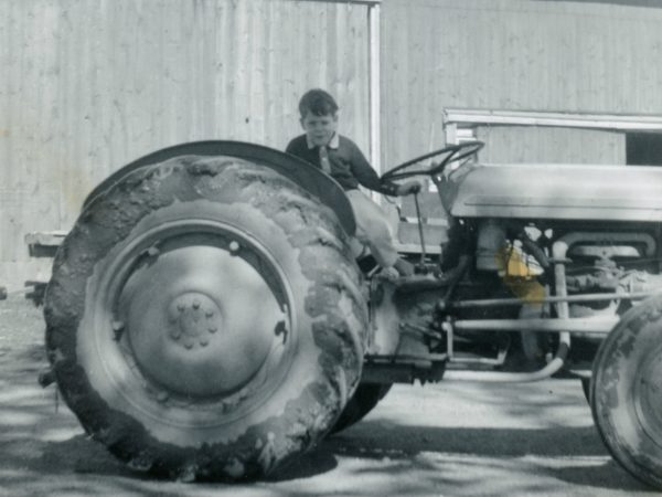 Child on farm tractor on Cuthbert Farm in Hammond