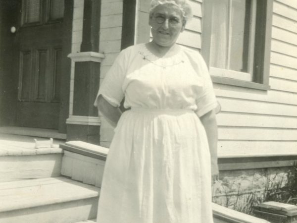 Nurse Patchen outside of a home in Hammond