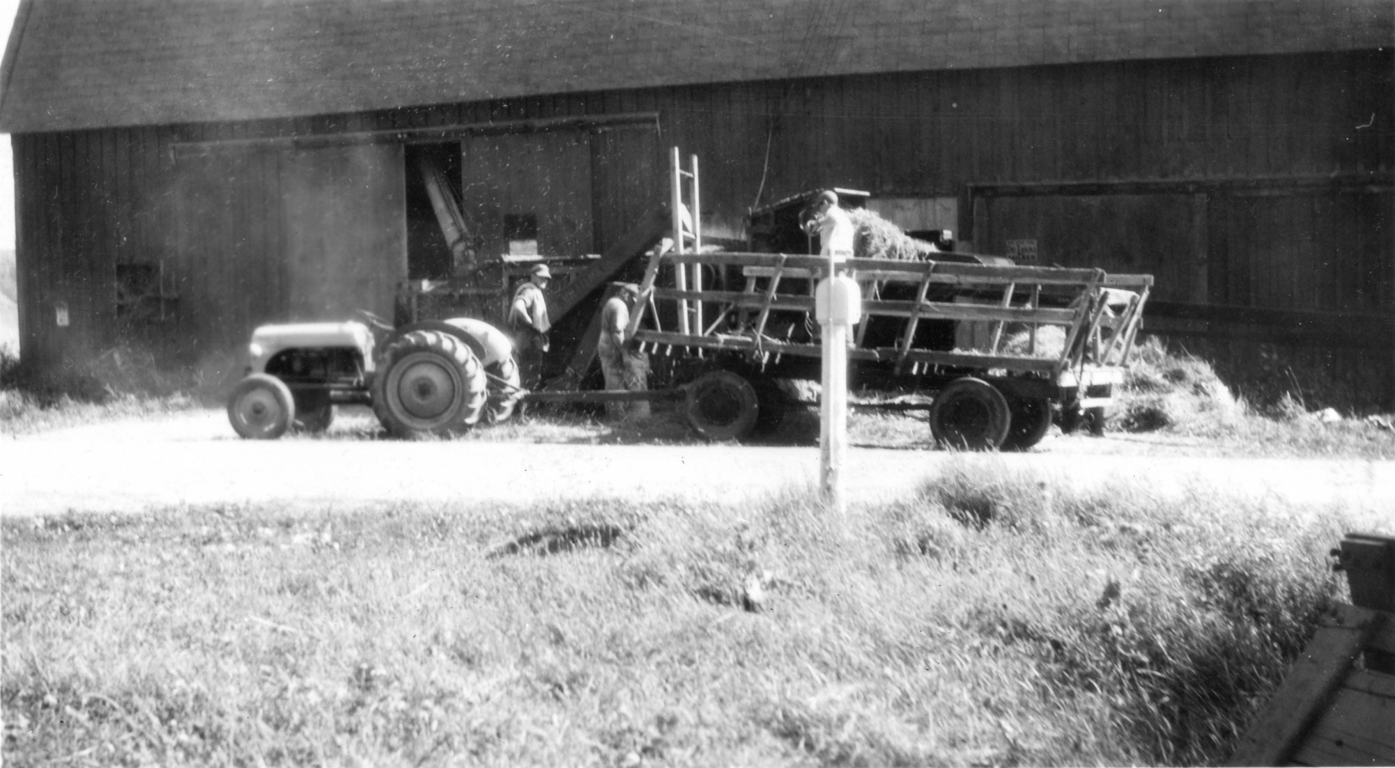 Men threshing oats on the McGregor Farm in Hammond