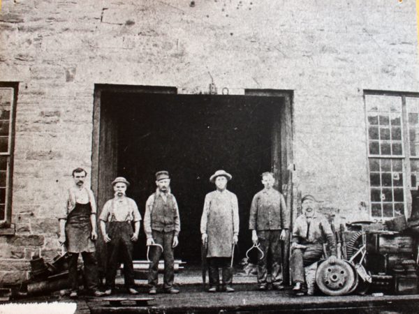 Portrait of workers outside a foundry in Potsdam