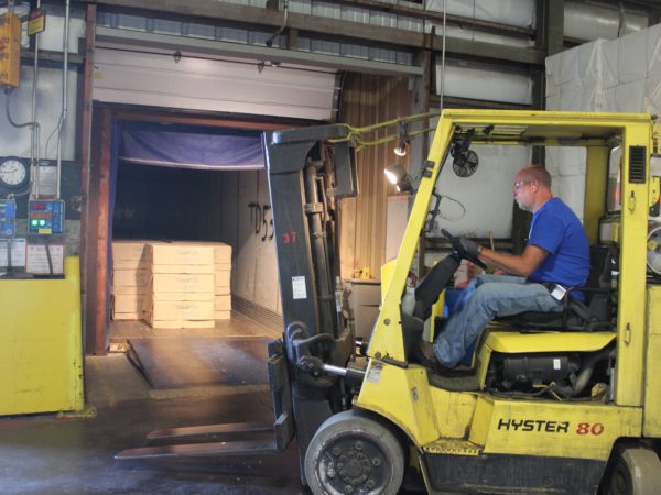 Preparing to forklift paper at the Potsdam Specialty Paper Company in Potsdam