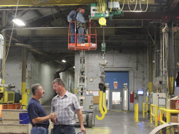 Men working inside the Potsdam Specialty Paper Company in Potsdam