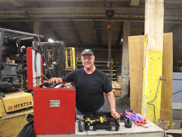 A worker inside the Potsdam Specialty Paper Company in Potsdam