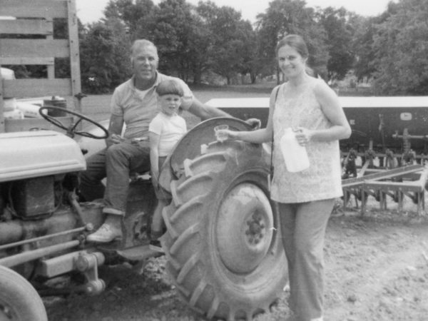 Hadlock family with their tractor on their dairy farm in Hammond