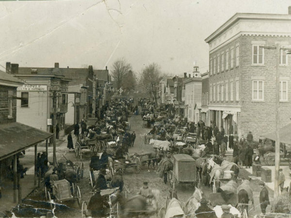 People and wagons line the streets for Turkey Day in Heuvelton