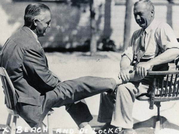 Doctor Locke treating adjusts a man’s feet in Williamsburg