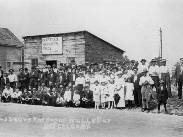 Striking paper mill workers and families in front of the strike office in Deferiet