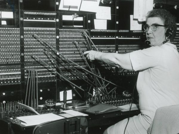 Erma Scholl working a telephone operation switchboard in Old Forge