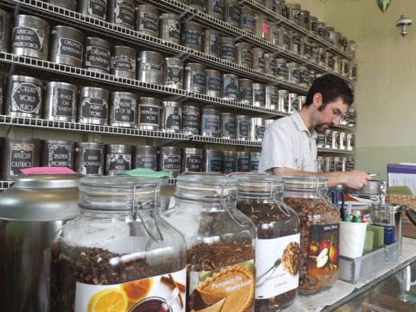 Ben Kemp at the counter of Sensibiliti Teas at The Shirt Factory in Glens Falls