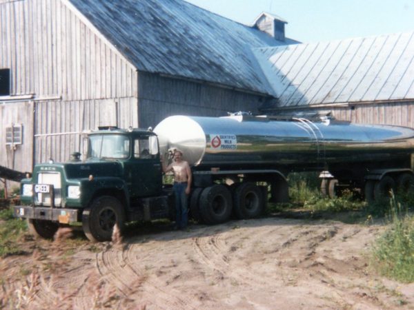 Bill Hull in front of his milk truck in Lisbon