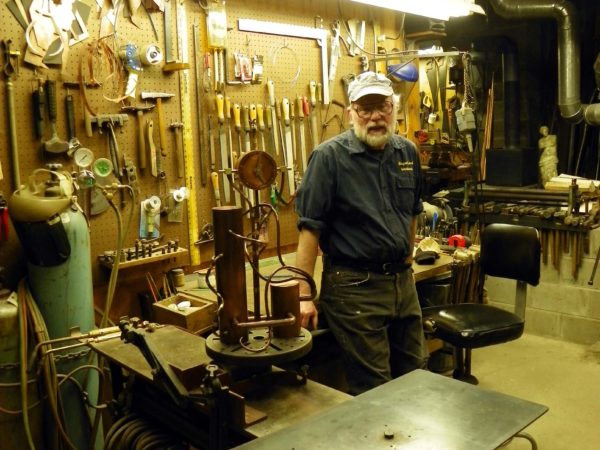 Malcolm Owen inside of his metalworking studio in Pierrepont