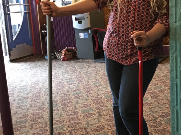 Helen Zyma sweeps the lobby of The Strand theater in Old Forge