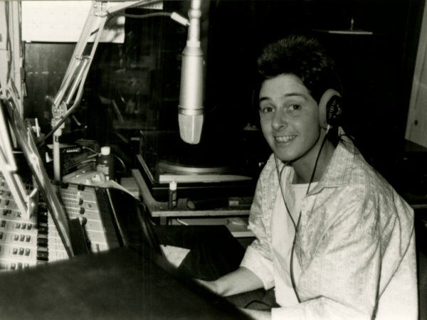 WSLU announcer in the control room in Canton