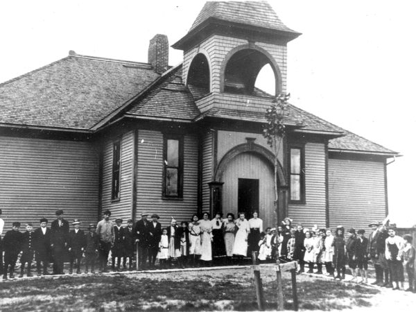 Students and teachers outside of the school in Pyrites