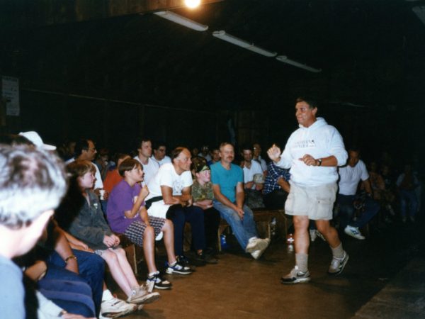 Mickey Sammons leads singing at Northern Frontier Camp in North River