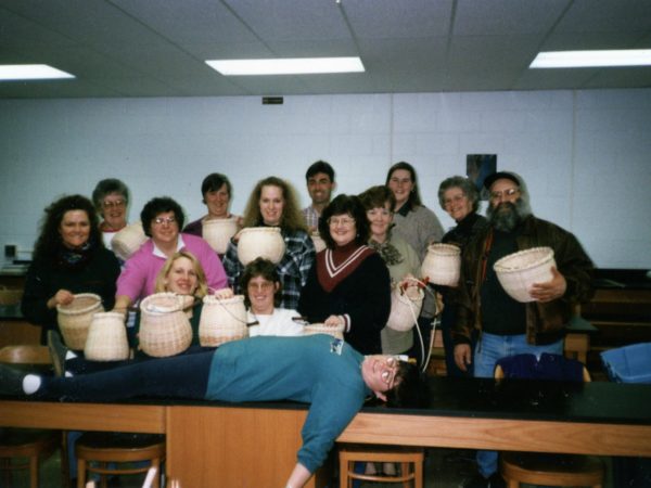 Patty Farrell teaches with basket weaving class in Ogdensburg