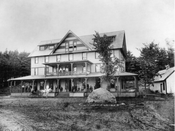 Employees on the porches of the Adirondack Hotel in Long Lake