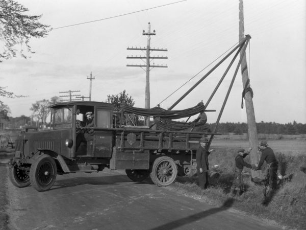 Mountain Home Telephone Company erect telephone pole.in Clinton County