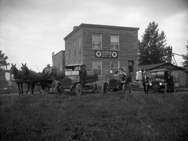 Texaco Station, horse drawn wagons and automobiles in Clinton County