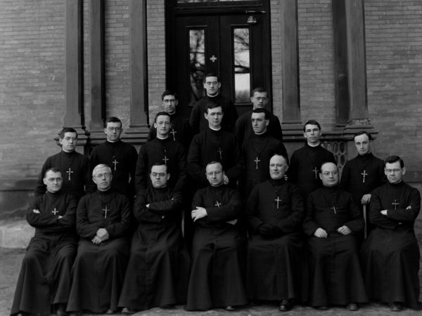 Group photo of clergymen from Mount Assumption Institute on South Catherine Street in Plattsburgh. Date unknown. MAI closed but the builing remains as apartments. Clinton County Historical Association. Brewer Collection.