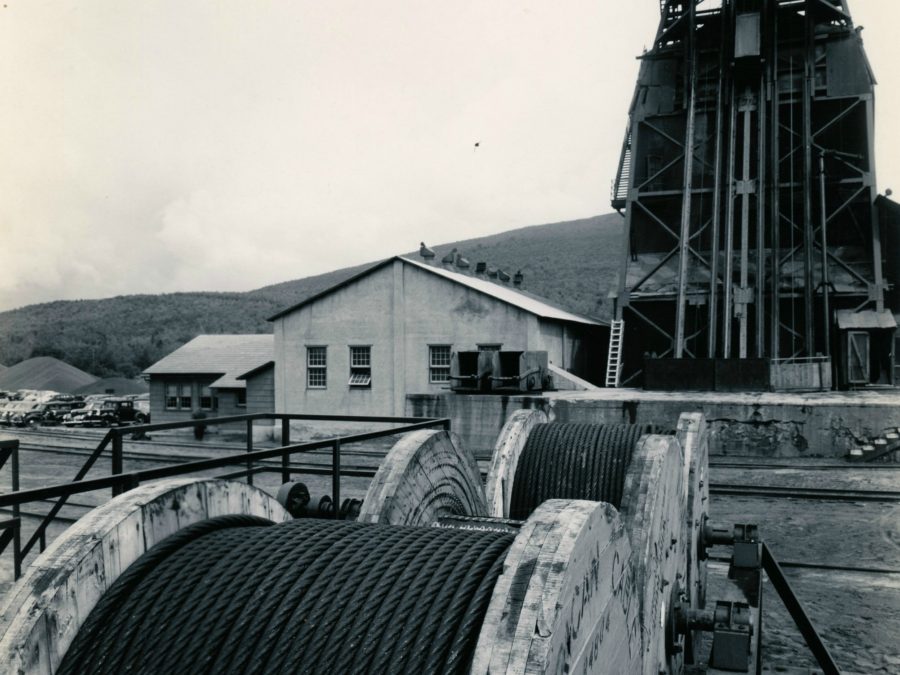 Men being lowered by skip into Lyon Mountain Mine in Lyon Mountain