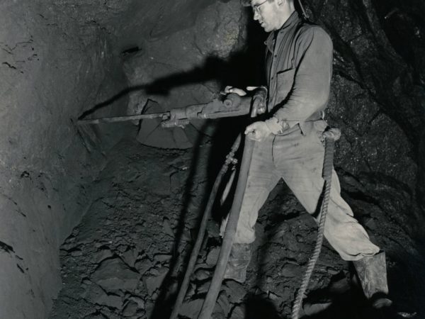 Miner uses air-pressured drill in the mines in Lyon Mountain