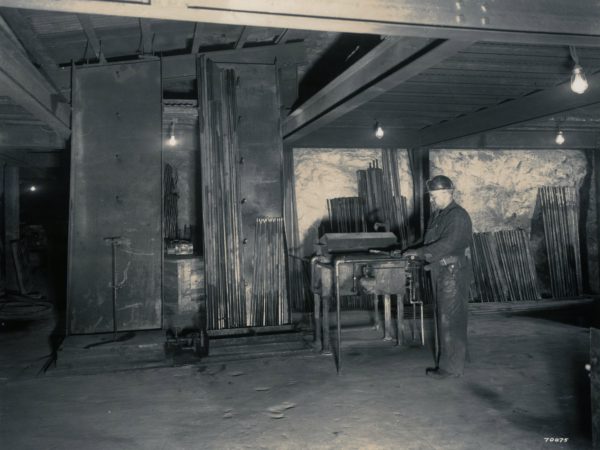 Richard Carson in mine drill shop in Lyon Mountain