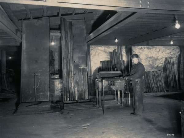 Richard Carson in mine drill shop in Lyon Mountain