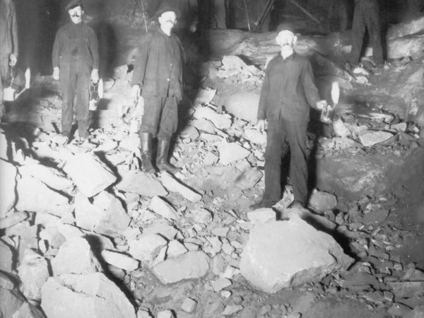 Miners underground with oil lamps in Lyon Mountain