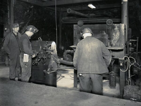 Roy Hicks and Joe Pascal in mine drill shop in Lyon Mountain