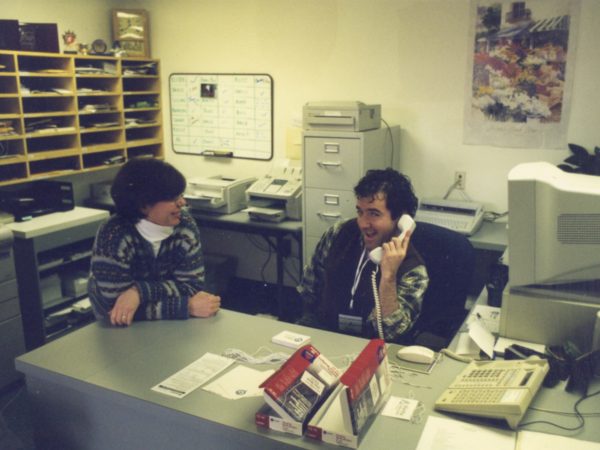 Kelly Trombley and David Sommerstein at front desk of NCPR in Canton