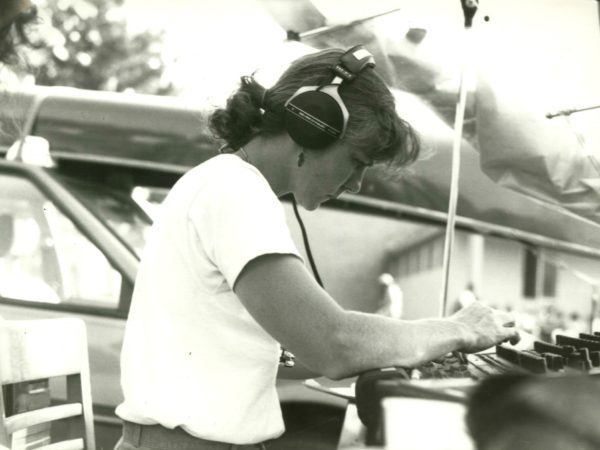 Beverly Hickman of NCPR mixes sound at a music festival in Paul Smiths