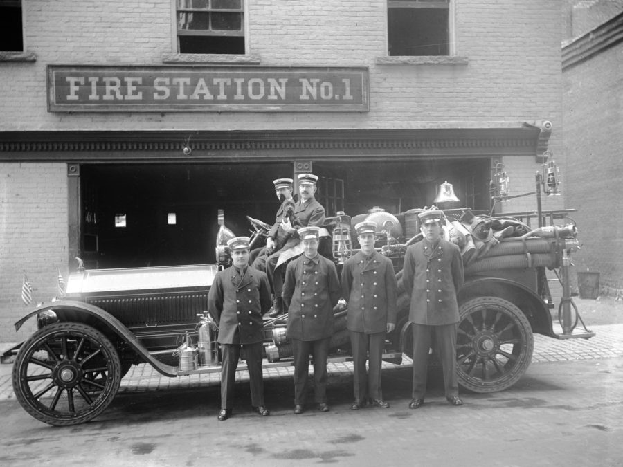 Firefighter Arthur Deline on a motorcycle in Watertown